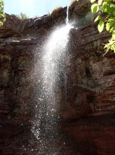 WaterfallSunlight_5-4-09 The sun was perfect for a sparkling waterfall. I stood in the waterfall's rain. The pool is one or one-and-one-half feet deep and the falls are around forty feet tall.
